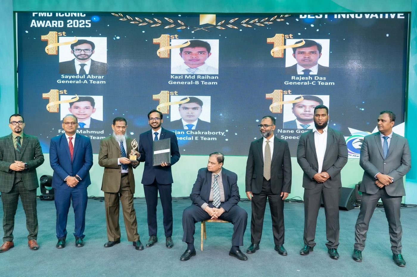Annual PMD Iconic Award 2025 stage with a screen showing Sayedul Abrar as 1st place, Best Innovative, General-A Team